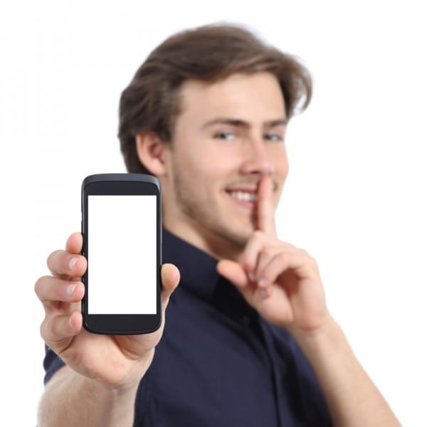 Man Showing Mobile Phone Screen And Asking For Silence