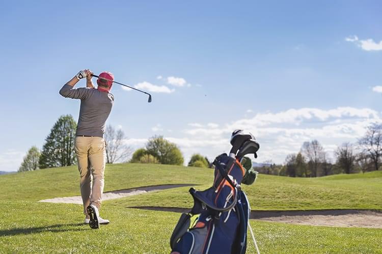 bigstock-Male-golf-player-swinging-golf-89927666
